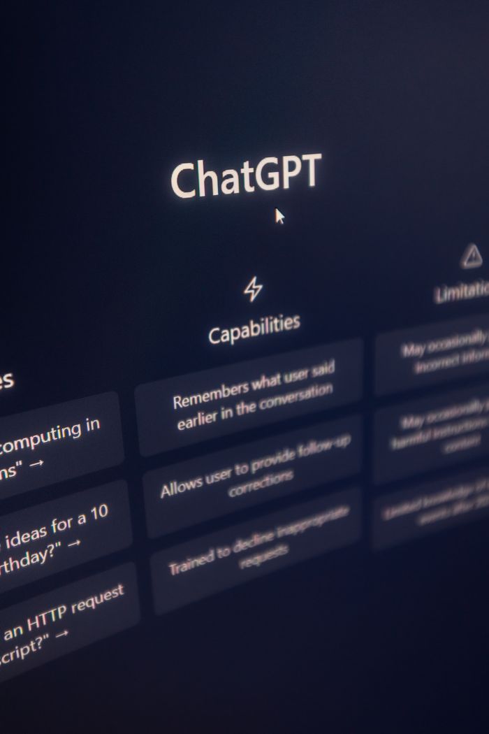Vertical shot of ChatGPT interface on screen highlighting AI capabilities.