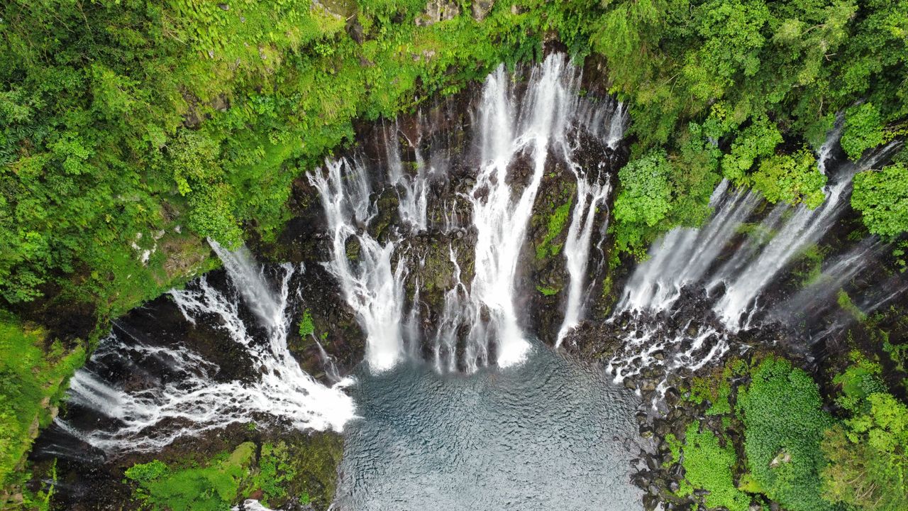 Stunning aerial shot of Grand Galet Falls in lush Reunion National Park.